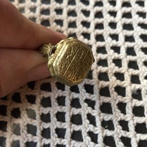 Vintage brass ring with writing on it